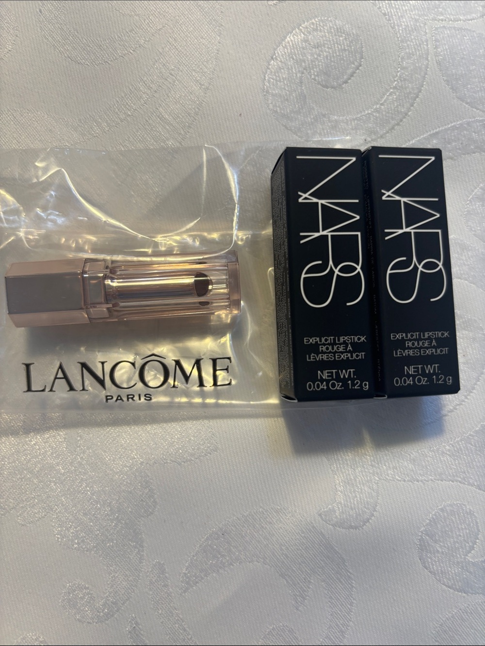 2 NARS mini Lipsticks and 1 Lancome mini lip balm